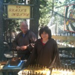 Isaac Martinez as one of the chess playing Monks at the Renaissance Festival.  Richard "Buck" Buchanan is in the background.