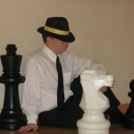 Randy visits the land of giants for a game of chess